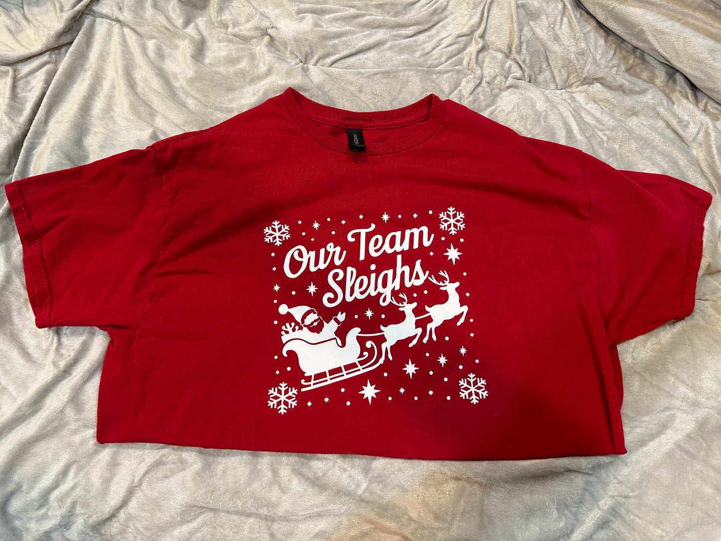 Our team sleighs graphic tee
