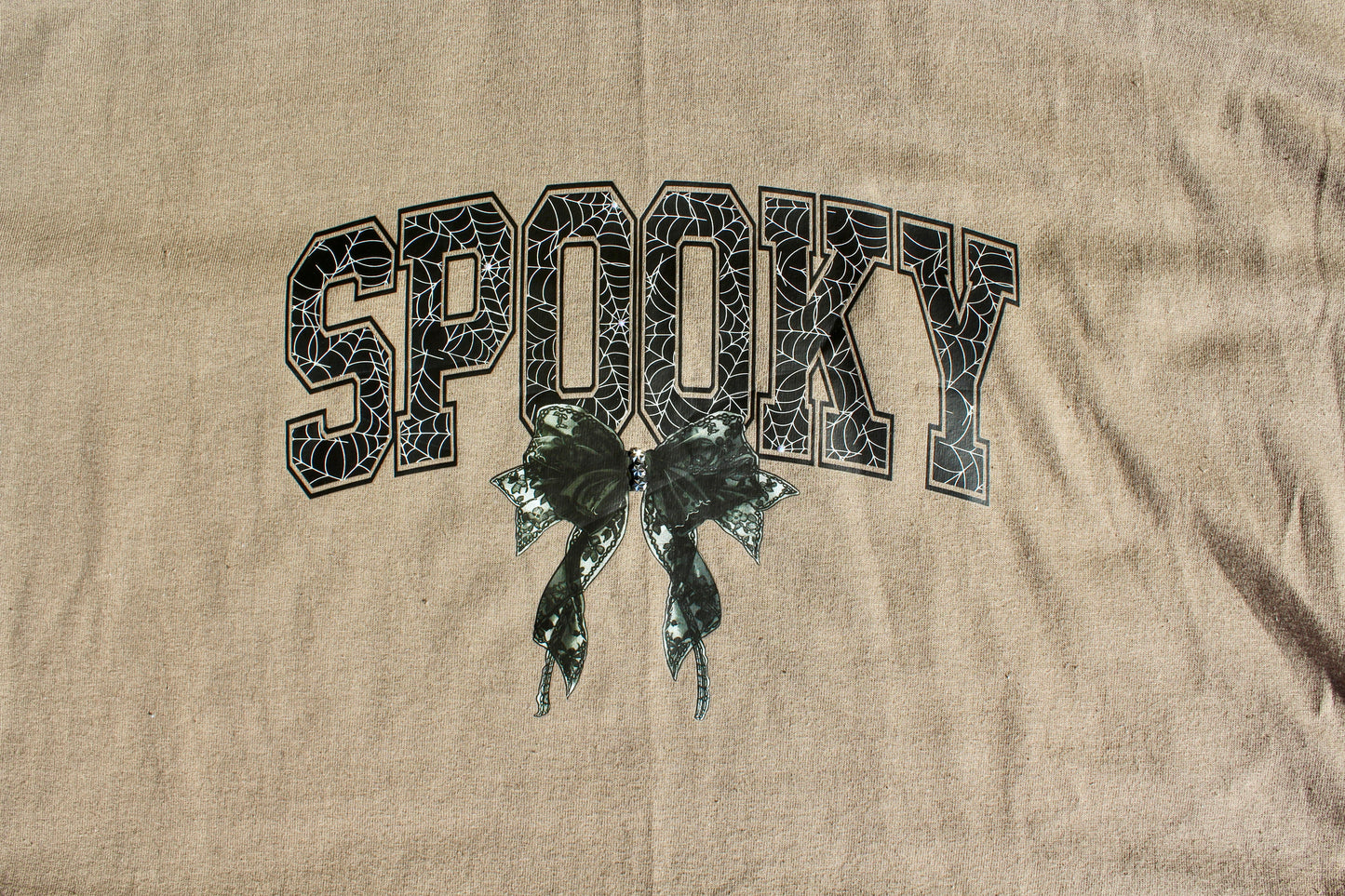 Spooky webbed bow shirt