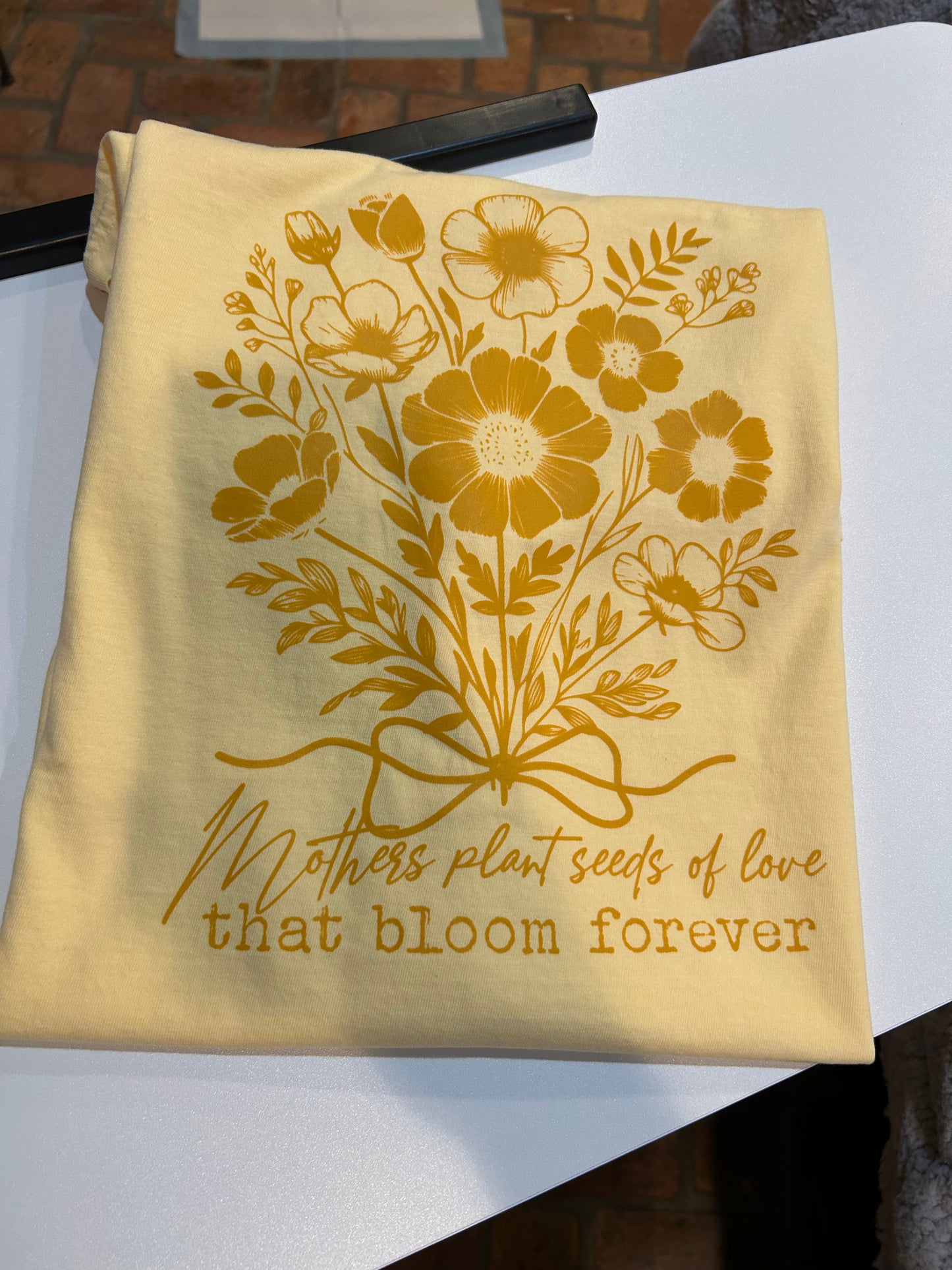 Mothers plant seeds graphic tee